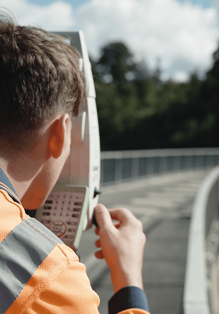 Person using a surveying device