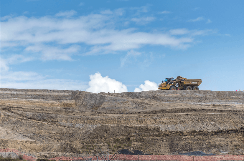 Image of land development with a earth moving machine